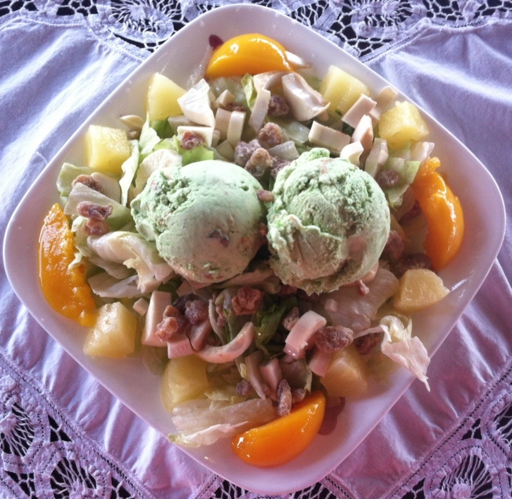 A heart of palm salad as prepared by the Seabreeze Restaurant in Cedar Key. The tartness of the heart of palm is complemented by the sweetness of fresh fruit and the pistachio ice cream in the middle. Photo courtesy of Jamie Griffin (2014).