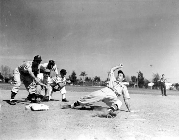 Ben Podolsky slides into base while Elisha Matthew 