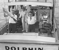 A couple holding up their catch of fish in the boat during the World Series of Sport Fishing - Pompano Beach, Florida.