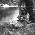 Eugenia Sisinni Jones playing a guitar during the Florida Folk Festival on the grounds of the Stephen Foster Memorial - White Springs, Florida