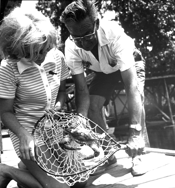 A couple showing off their blue crab catch at Salt Springs (circa 1960s).