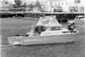 The Coral Sands being towed into Key West with Cuban refugees during the Mariel Boatlift.