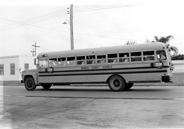 Monroe County school bus filled with Marielitos passes Trumbo Point as it heads to Naval Air Station Boca Chica, also in Key West, to await final transfer to at a processing center in Miami.