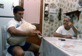 Greek bagpipe player Nikitas Tsimouris, right, listens as apprentice and grand-nephew Nikitas Kavouklis plays the instrument, called a tsabouna - Tarpon Springs, Florida