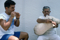 Greek bagpipe player Nikitas Tsimouris, right, plays the tsabouna, accompanied by his apprentice and grand-nephew Nikitas Kavouklis on the practice chanter - Tarpon Springs, Florida