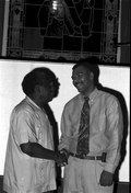 Hymn liner Troy Demps, left, shakes hands with his apprentice Brian Wright - Orlando, Florida.