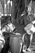 Frederick Massena, left, and Jamail Malcolm X Cesar of the Haitian Rara band Konbo Guinyn performing - Miami, Florida