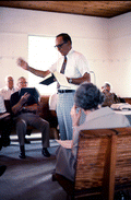 Man leading Sacred Harp singing at the Bethlehem Primitive Baptist Church - Old Chicora, Florida