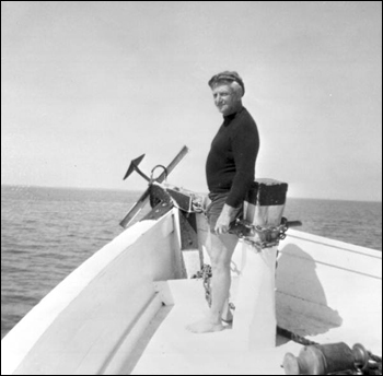 Treasure hunter Art McKee standing at the bow of a boat (1967)