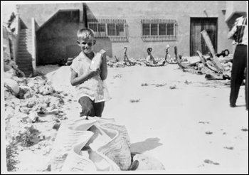 Art McKee's son, Mick, posing with items at his father's museum : Plantation Key, Florida (1956)