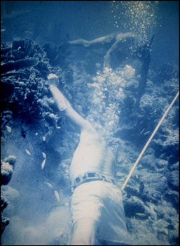 Art working edge of ballast pile of what is believed to be the Genovesa shipwreck (1979)