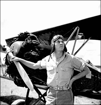 Bill Tankersley from the NYA's Camp Roosevelt posing in front of an airplane: Ocala, Florida