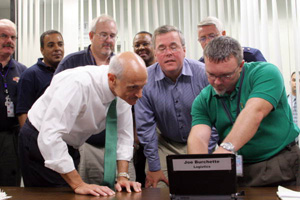 FEMA contractor demonstrating new system to Governor Jeb Bush and Michael Chertoff, Secretary, U.S. Department of Homeland Security (2006)