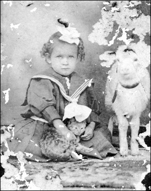 Portrait of Hazel Harrell with a cat and goat