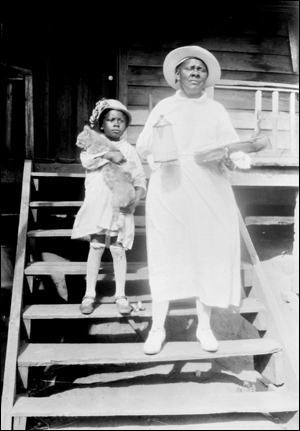 Woman, child, and cat (1928?)