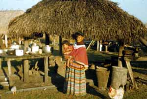 Woman with child at the Dania Seminole Indian Reservation (1958)