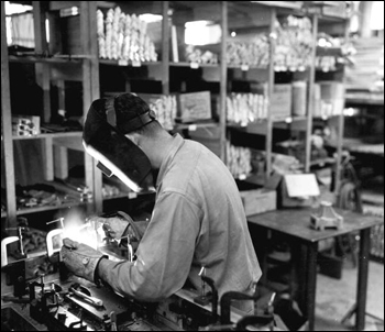 A worker heli-arc welding at the Visioneering Company: Sarasota, Florida (1959)