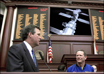 Governor Bush and astronaut David Brown conversing with astronauts at the International Space Station from the Florida House chamber: Tallahassee, Florida (2001)