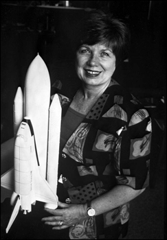 JoAnn Hardin Morgan, posing with space shuttle model (1995)