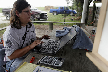 Leoma Simmons at laptop computer. Big Cypress Seminole Indian Reservation, July 2007.