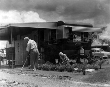 Unidentified couple tends to their yard at Trailer Estates: Sarasota, Florida (1967)