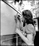 Painting logo on truck : Ocala, Florida (ca. 1940)