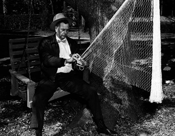 H. O. Marshall knitting a cast net: Apalachicola, Florida (1958)