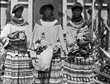 Miccosukee women with their crafts outside the mission