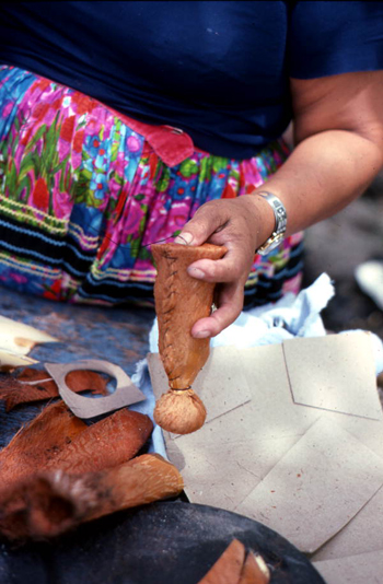 Mary Billie sewing on the bottom of the Seminole doll she is making: Big Cypress Seminole Indian Reservation, Florida 