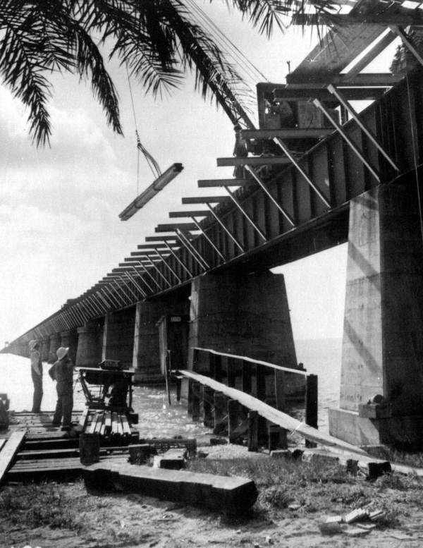 Converting the Florida East Coast Railway to the Overseas Highway between Big Pine Key and Lower Matecumbe Key. Note that a few crossties are still visible in the image here (1937).