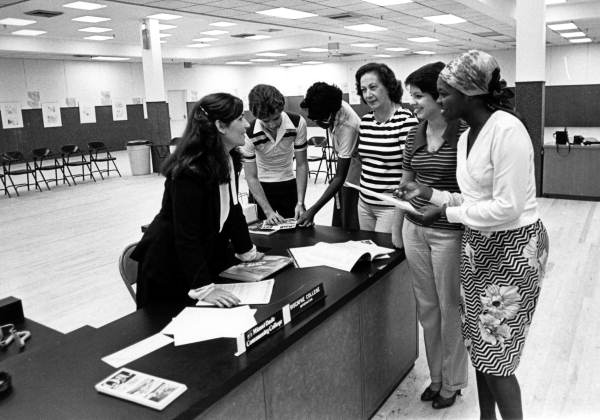 People at the Miami Dade Community College outreach information center in the Palm Springs Mile mall, Hialeah, Florida.