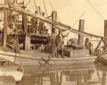 Oyster fishermen on a boat in dock at Apalachicola, Florida.