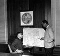 Secretary of State Tom Adams and Director Randolph Hodges from the Board of Conservation studying proposed barge canal