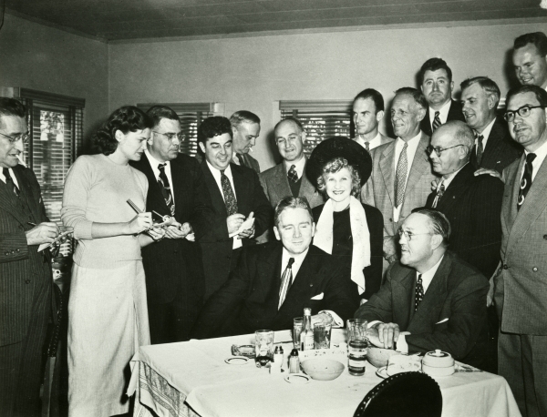 Capitol Press Corps interviewing Governor Fuller Warren at the Silver Slipper restaurant , 1949. Frye is pictured second from left.