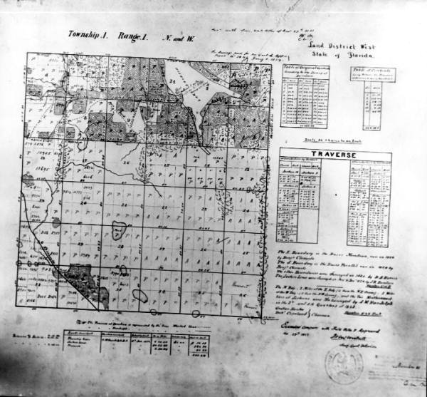 An early map of Township 1 North, Range 1 West, encompassing much of western Tallahassee. The map delineates the 36 one-mile square sections within the township, as well as numerous individual parcels of land that had already been purchased (1853).