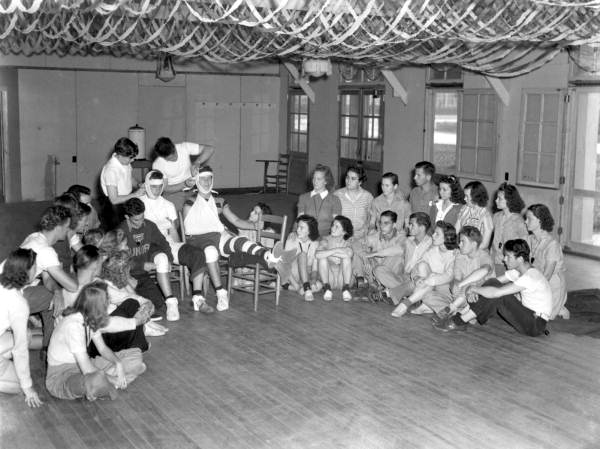 Students practice bandaging in first aid class at Camp Roosevelt (April 4, 1941).