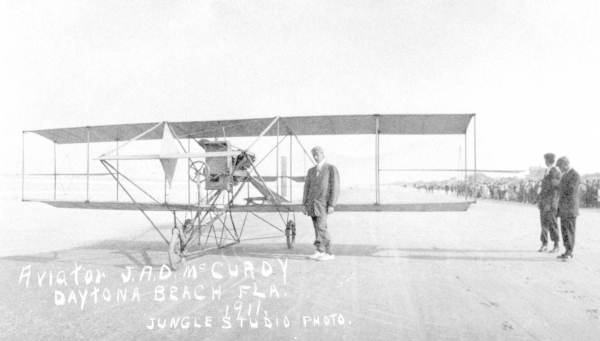 John McCurdy, Canada's first licensed airplane pilot, with his aircraft at Daytona Beach (1911).