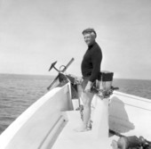 Treasure hunter Art McKee standing at the bow of a boat