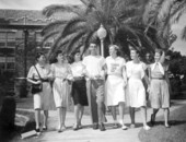 Female students gather around a male student at Florida State College for Women - Tallahassee, Florida