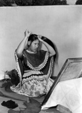 Seminole Indian woman Letagi (who has taken the Christian name of Frances Willie) styling her hair in Miami, Florida.