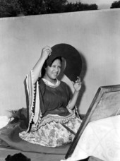 Seminole Indian woman Letagi (who has taken the Christian name of Frances Willie) styling her hair in Miami, Florida.