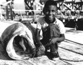 Young boy with goliath grouper :Boca Grande, Florida