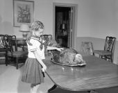 Governor Collins' daughter Darby with Thanksgiving turkey at mansion - Tallahassee, Florida.