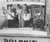 A couple holding up their catch of fish in the boat during the World Series of Sport Fishing - Pompano Beach, Florida.