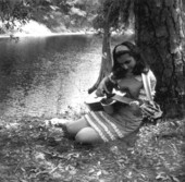 Eugenia Sisinni Jones playing a guitar during the Florida Folk Festival on the grounds of the Stephen Foster Memorial - White Springs, Florida