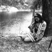 Eugenia Sisinni Jones playing a guitar during the Florida Folk Festival on the grounds of the Stephen Foster Memorial - White Springs, Florida