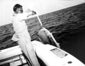 A fisherman uses a gaff to land a big fish during the Shakespeare fishing trip - Panama City, Florida.