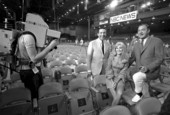 Governor Kirk being filmed with CBS news anchor Mike Wallace and an unidentified woman in convention hall - Miami Beach, Florida.