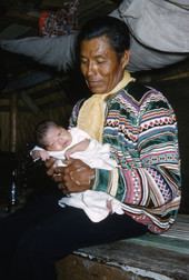 Jimmie Billie with new daughter Marie in the Everglades.