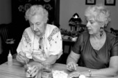 Apprentice Mary Martin (R) observes Ola Kryway dyeing an Easter egg - Titusville, Florida.